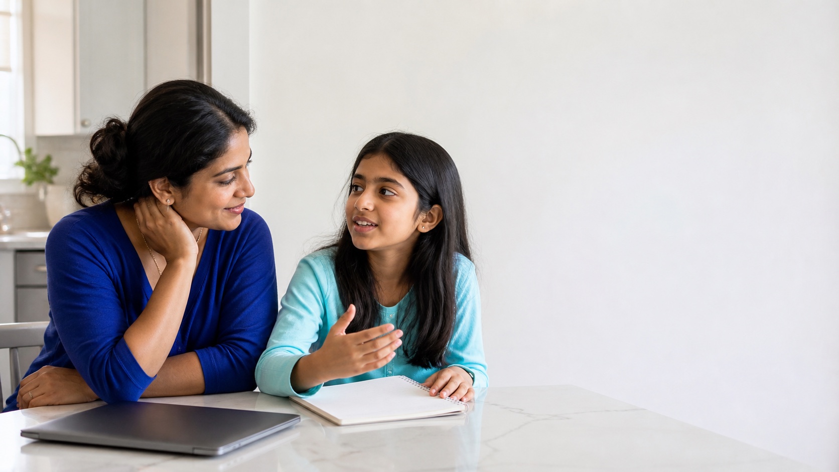 Mother listening as her middle school daughter discusses school planning